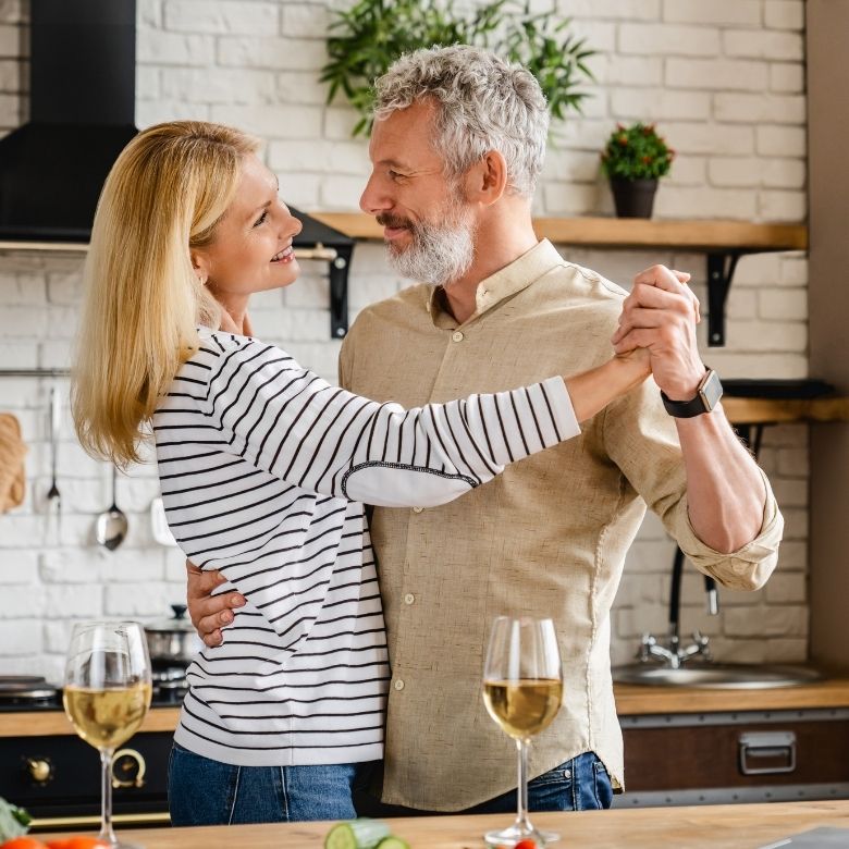 Couple dancing in kitchen