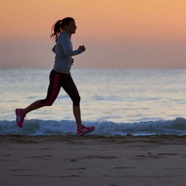Woman running on the beach